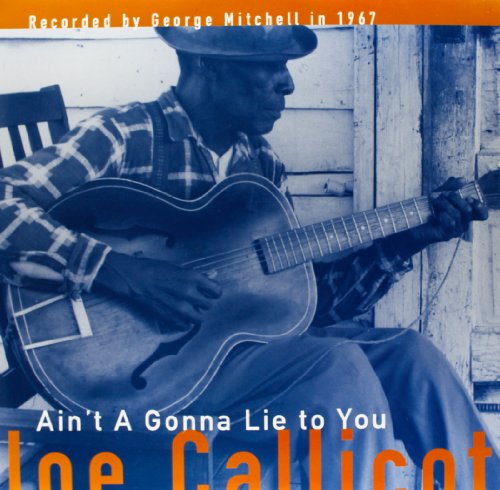 Black and white photo of Joe Callicott playing an acoustic guitar.