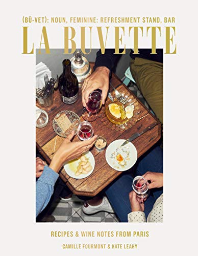Cookbook cover with a table scene of food, wine, and hands.