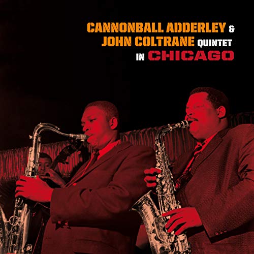 Jazz musicians Cannonball Adderley and John Coltrane playing saxophones.