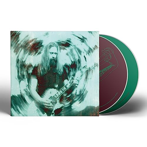 CD cover featuring a bearded man with a guitar and a colored vinyl record.