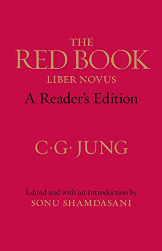 The book cover is solid red with gold text reading The Red Book C.G. Jung.