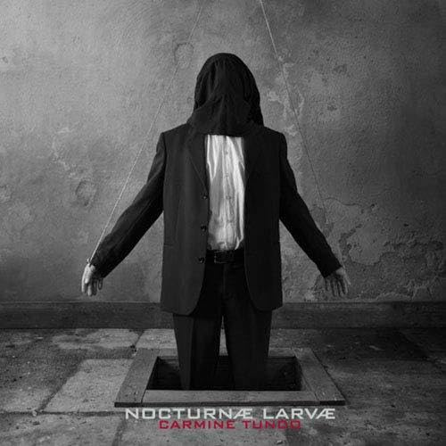 Black and white album cover featuring a hooded figure standing in a square.