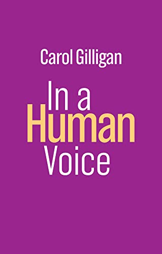 Book cover: “In a Human Voice” by Carol Gilligan, purple background.