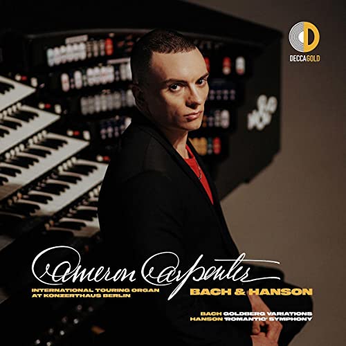 CD cover featuring Cameron Carpenter beside a large pipe organ.