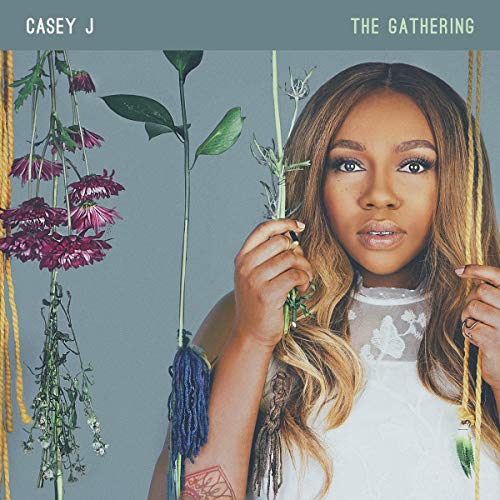 Casey J album cover featuring a woman with flowers and braided rope.