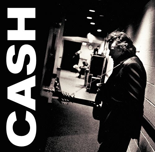 Black and white photo of Johnny Cash in profile with "CASH" in large text.