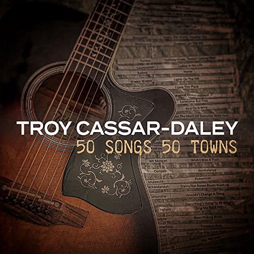 Acoustic guitar with album title "Troy Cassar-Daley: 50 Songs 50 Towns.