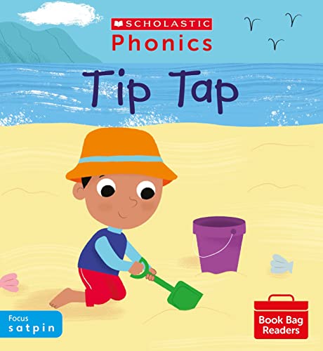 A child in an orange hat plays with a green shovel on the beach.