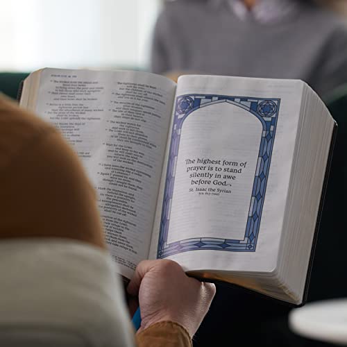 A person holding an open Bible featuring a decorative quote page with blue borders.