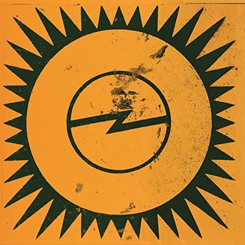 A distressed orange square featuring a dark green sun icon with a lightning bolt.