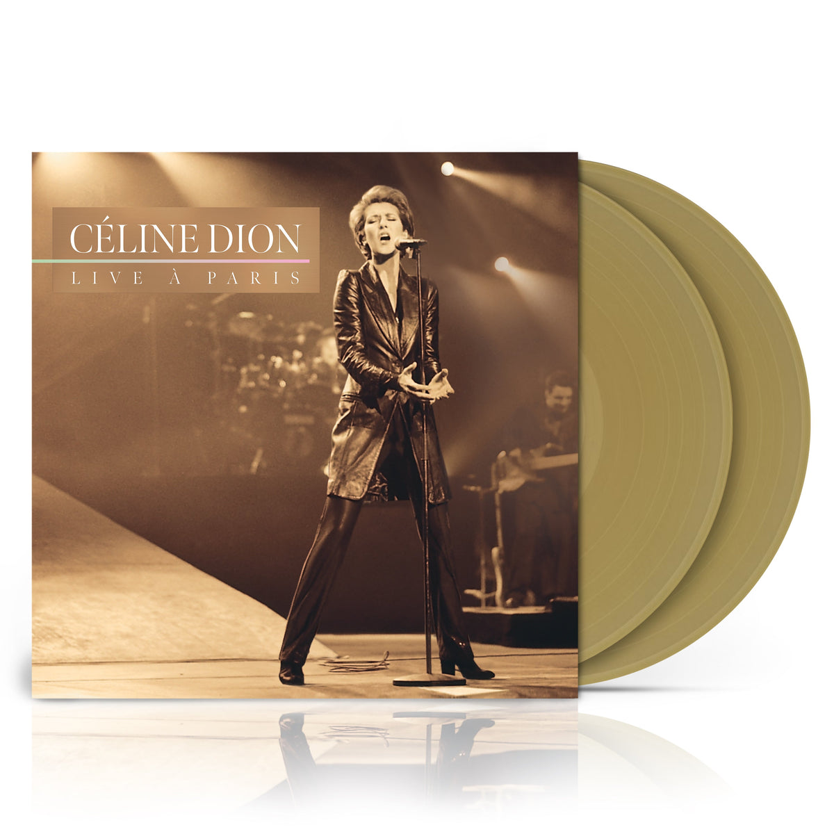 Céline Dion album cover and two golden tan vinyl records.