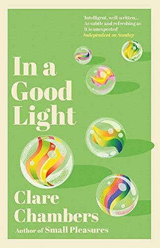 Book cover for In a Good Light by Clare Chambers featuring colorful glass marbles.