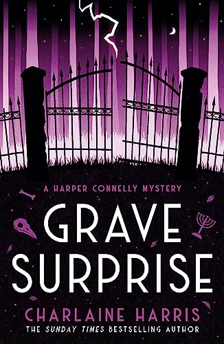 Book cover: cemetery gates silhouetted against a stormy purple sky.