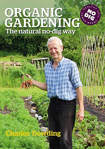 Book cover featuring Charles Dowding holding freshly harvested carrots in a lush vegetable garden.