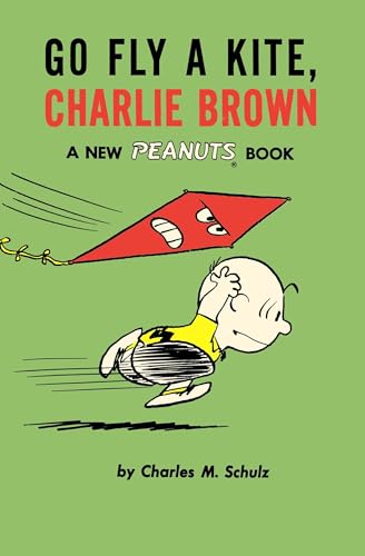 Charlie Brown running with a red kite featuring an angry face.