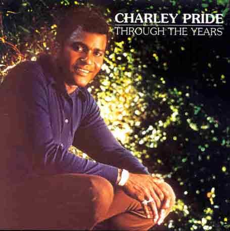 Charley Pride album cover, portrait of a smiling man in a dark suit.