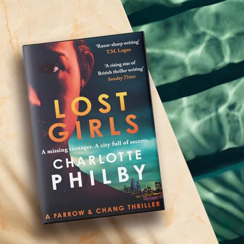 Book cover with a shadowed face, titled "Lost Girls" by Charlotte Philby.