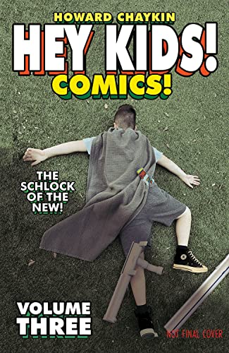 Comic book cover: boy lying on grass with a cape and toy gun.