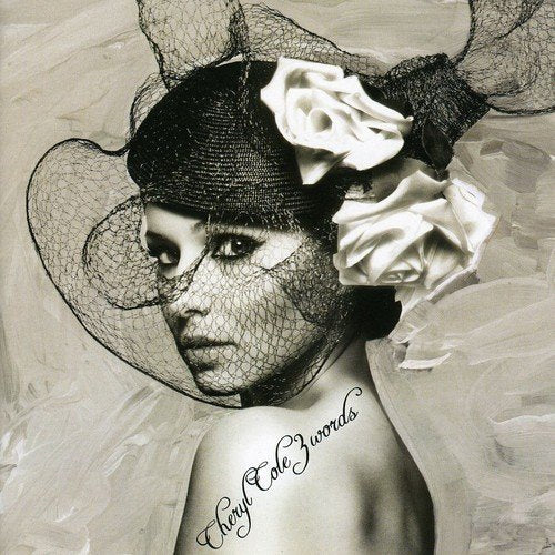 Black and white portrait of Cheryl Cole with a floral hat.