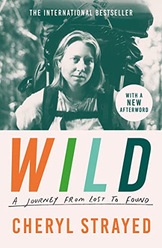 Book cover showing a woman with a large backpack, titled Wild by Cheryl Strayed.