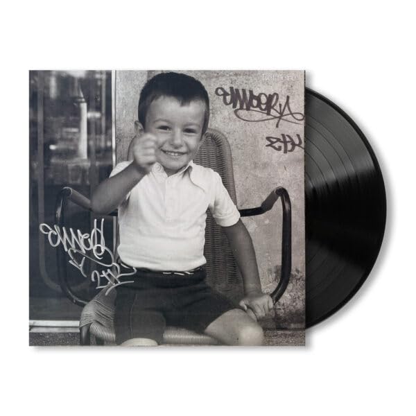 Black vinyl record with cover featuring a smiling boy and graffiti.
