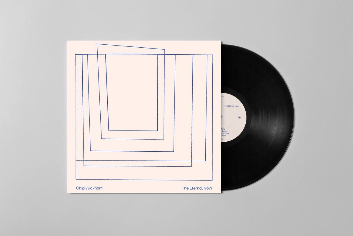 Vinyl record and album cover with blue geometric lines on beige.