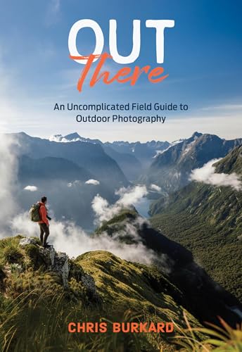 Book cover: “Out There” with a mountain landscape and photographer.