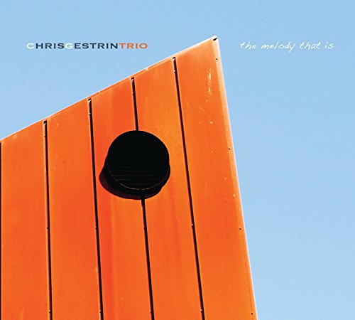 CD cover with orange angled structure against a blue sky.