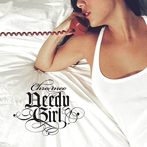 Woman in a white tank top lying on a bed holding a red telephone.