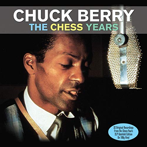 Chuck Berry singing into a vintage microphone on a vinyl album cover.