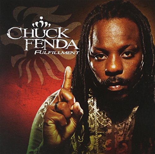Chuck Fenda album cover, portrait of a man with dreadlocks pointing upwards.