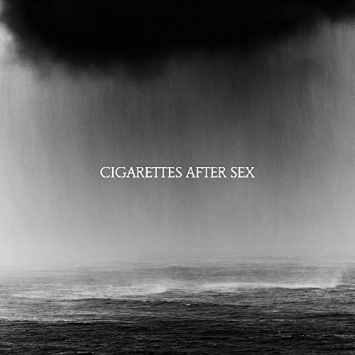 Black and white album cover with ocean and rain, text reads “Cigarettes After Sex.”
