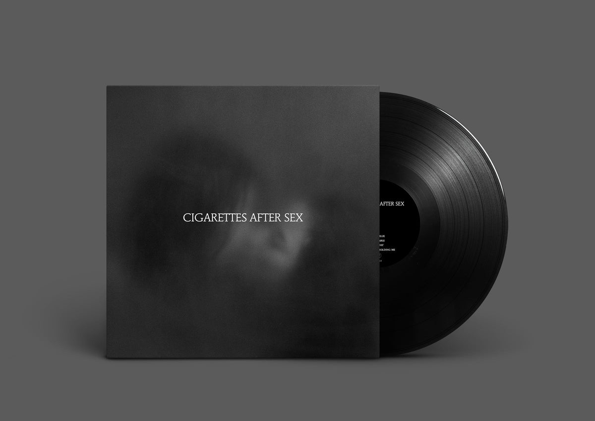 Black vinyl record with white text “Cigarettes After Sex” on cover.