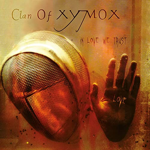 Album cover with masked face and outstretched hand, word "love" written on it.