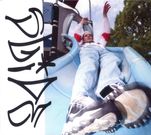 Person in a light blue jumpsuit on a blue playground slide.