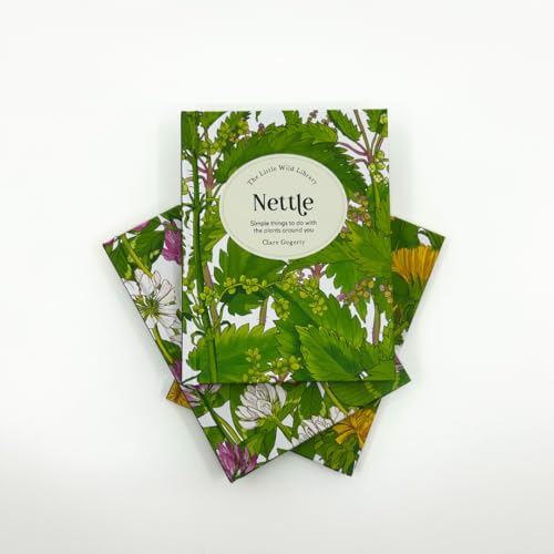 Three copies of the book Nettle with botanical illustrations fanned out on white background.