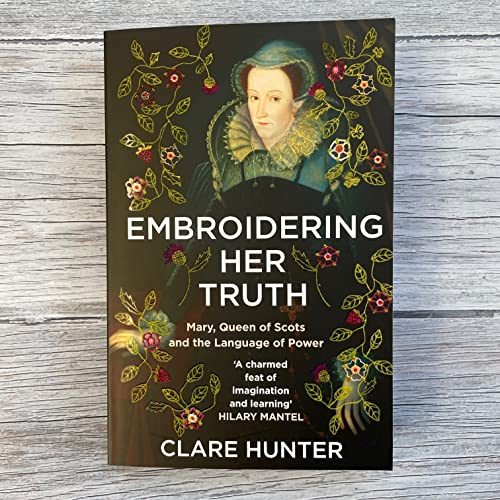 Book cover featuring a portrait of Mary, Queen of Scots surrounded by floral embroidery.