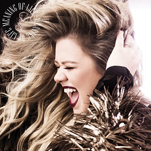 Kelly Clarkson album cover, "Meaning Of Life", with dramatic portrait.
