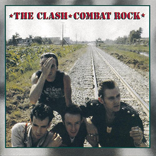 The Clash Combat Rock album cover featuring band members crouching by railroad tracks.