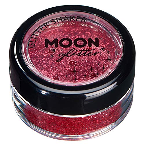 Red cosmetic glitter in a clear jar with a black lid.