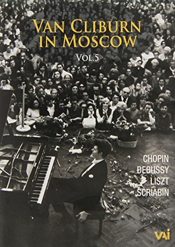 Van Cliburn at a piano, performing to a crowded audience in Moscow.