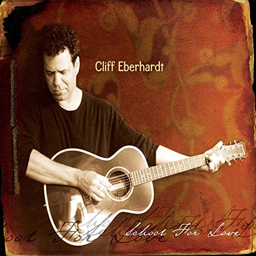 Cliff Eberhardt holding an acoustic guitar on album cover, sepia tone.