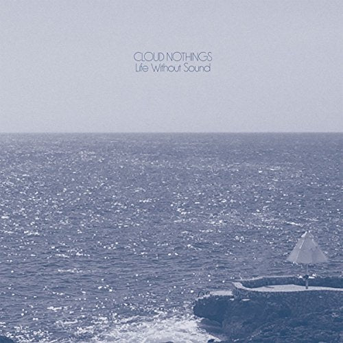 Cloud Nothings album cover: ocean view with small white structure.