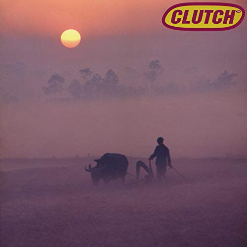 "Clutch vinyl record cover featuring a man plowing with oxen at sunrise in a misty field."