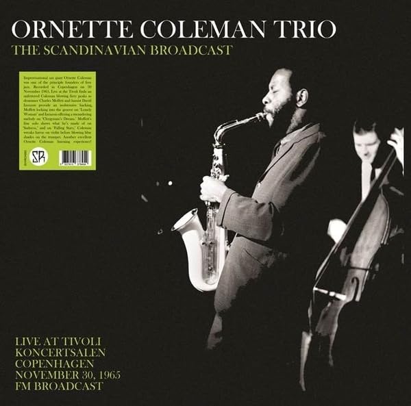 Ornette Coleman playing saxophone with a bassist in a live performance.