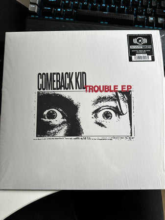 Vinyl record for Comeback Kid’s “Trouble EP” with intense eye graphic.