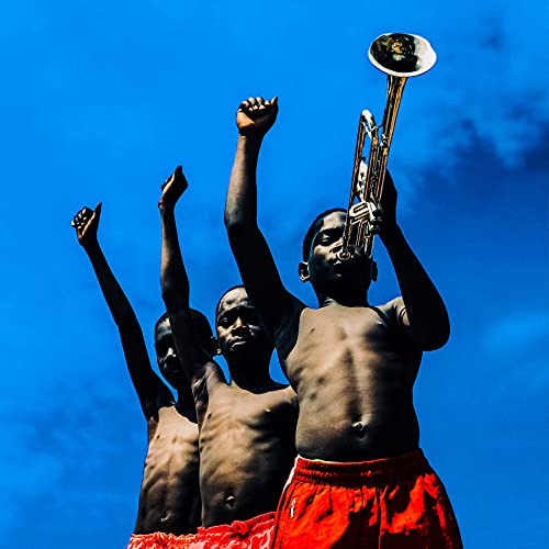 Album cover: three shirtless people with raised fists and a trombone.