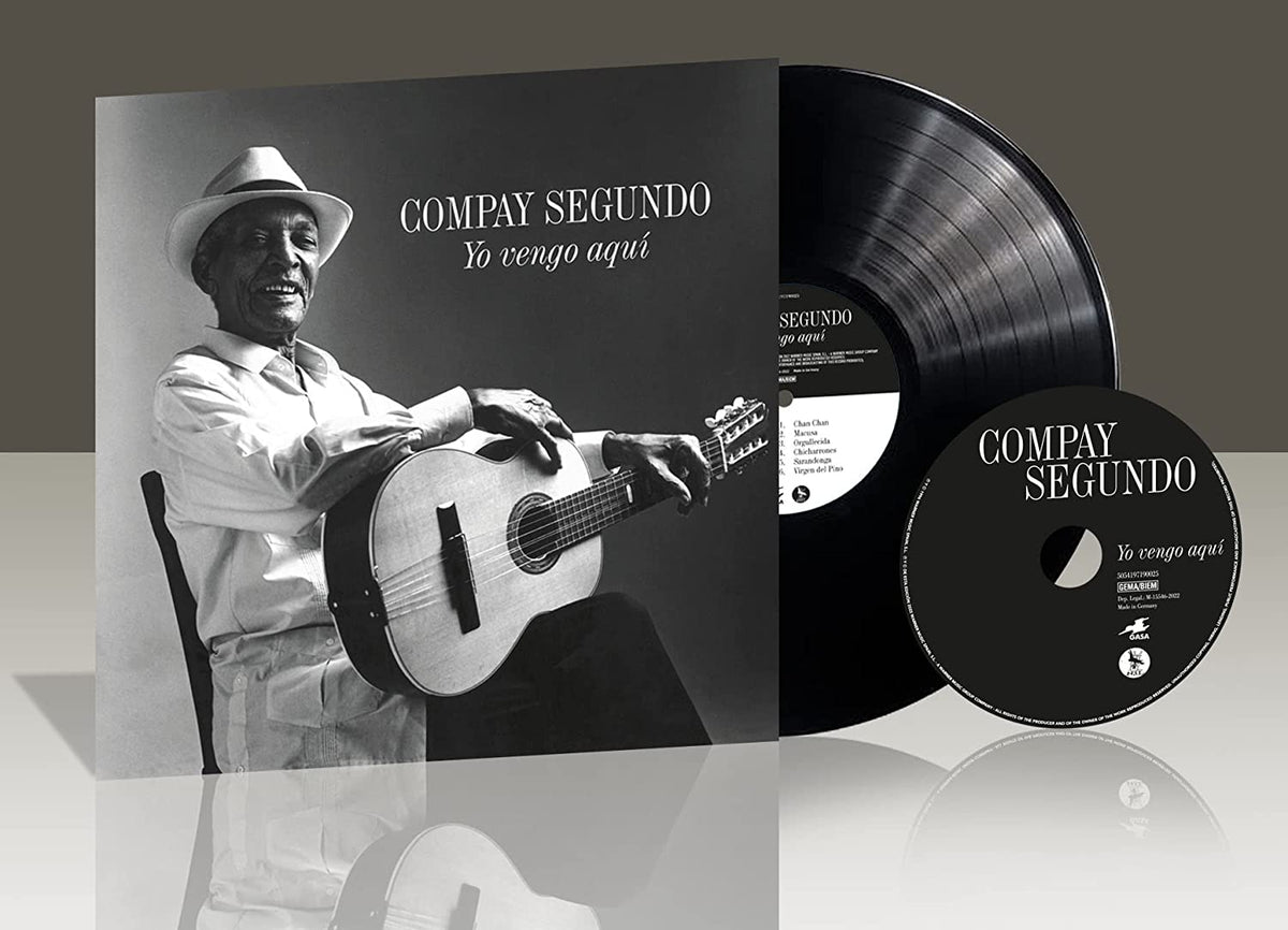Compay Segundo album cover with vinyl record, featuring a portrait of a guitarist.