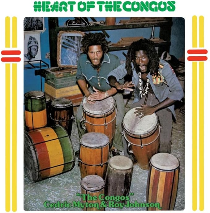 Album cover featuring three men with dreadlocks and colorful drums.