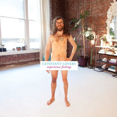 Nude man with beard stands in a bright room, album title overlaid.